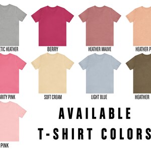 K&ouml;nnte beinhalten: Eine Tabelle mit 10 verschiedenen T-Shirt-Farben, die zum Kauf angeboten werden. Die Farben sind: Sportliches Grau, Beere, Heidekraut-Lila, Heidekraut-Pfirsich, Charity Pink, Soft Cream, Hellblau, Heidekraut-Olivengr&uuml;n und Pink. Der Text "VERF&Uuml;GBARE T-SHIRT-FARBEN" wird unter der Tabelle angezeigt.