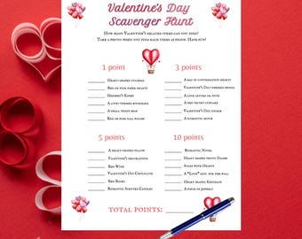 May include: A Valentine's Day Scavenger Hunt printable with a red background. The printable includes a list of Valentine's Day-themed items to find, with point values assigned to each item. A blue pen rests on the bottom right corner.