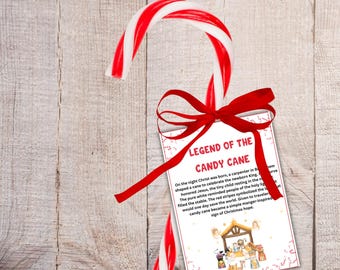 May include: A red and white striped candy cane with a red ribbon and a tag that reads "Legend of the Candy Cane." A snowflake and pinecone are also present, suggesting a Christmas theme.