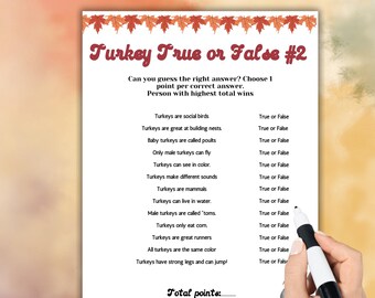 May include: Thanksgiving-themed game sheet titled "Turkey True or False #2". The sheet features a list of statements about turkeys, with space to mark "True" or "False". A hand holds a marker, ready to answer. The top banner reads "Thanksgiving".