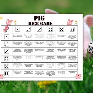 May include: A white game board titled "PIG DICE GAME" with a grid of instructions and dice illustrations. The game is set against a blurred background of a pig and green grass. A die with six dots is in the foreground.
