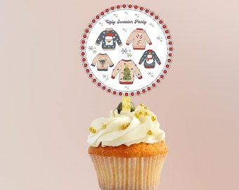 May include: A cupcake with white frosting and gold sprinkles topped with a round, white paper cupcake topper with a red border. The topper has a white background with the text "Ugly Sweater Party" and images of five different Christmas sweaters.