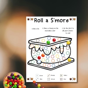 May include: A white game board with the text "Roll a S'more" and instructions. The board features a large s'more outline with colored circles. A bowl of colorful candies is in the lower left corner. The game is designed to match candy colors to the circles.