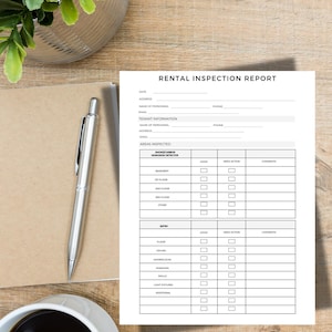 May include: A "Rental Inspection Report" form with fillable fields for date, address, and tenant information. A silver pen rests on a brown notepad next to the form. A cup of coffee and a plant are also in the image.