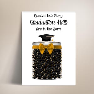 May include: A white card with the text "Guess How Many Graduation Hats Are in the Jar?" A clear jar filled with black graduation caps is topped with a gold bow and a black graduation cap.