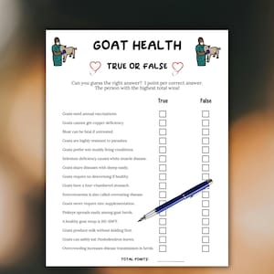 May include: A white paper titled "GOAT HEALTH TRUE OR FALSE" with a quiz format. The quiz includes questions about goat health, with "True" and "False" columns for answers. A blue pen rests on the paper, ready to mark the answers.