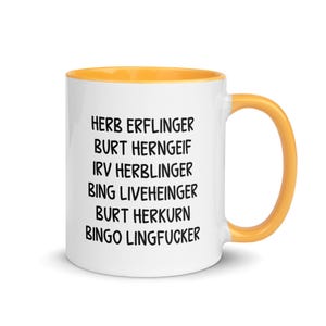 May include: White ceramic mug with a yellow interior and handle. The mug features black text listing names, including "HERB ERLINGER" and "BING LIVEHEINGER". A simple, yet eye-catching design for coffee or tea.