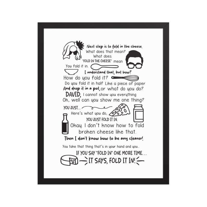 May include: A framed black and white print with text and illustrations about folding cheese. The text includes phrases like "Fold in the cheese" and "You just fold it in." The print features cartoon-style drawings of kitchen tools and ingredients.