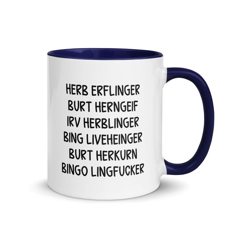 May include: A white ceramic mug with a navy blue interior and handle. The mug features black text listing several names. The mug is designed for beverages and is suitable for home or office use.
