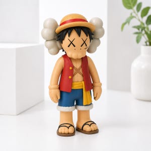 May include: A collectible vinyl figure of a character wearing a straw hat with a red band, a red vest, blue shorts, and sandals. The figure features black hair, an X-shaped scar on the chest, and signature cross-shaped eyes with gray cloud-like ears.