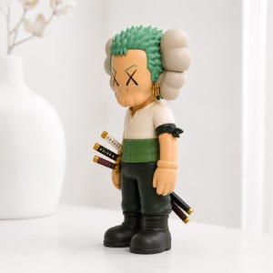 May include: A collectible vinyl figure featuring a character with green hair, X-shaped eyes, and large rounded ears. The figure wears a white shirt, a green sash, dark green pants, and black boots, with three miniature swords attached at the hip.