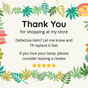 May include: A decorative card with a cream background, featuring the text "Thank You" in large black letters. The card includes a border of green and yellow leaves and a compass illustration. Text encourages reviews.