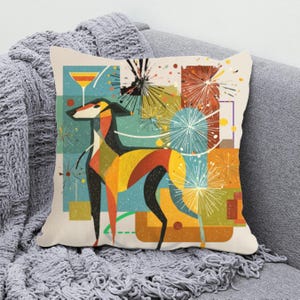 May include: Square throw pillow featuring a colorful, geometric illustration of a dog with a cocktail glass and fireworks. The dog is depicted in shades of black, yellow, orange, and red. The background includes teal, orange, and yellow squares.