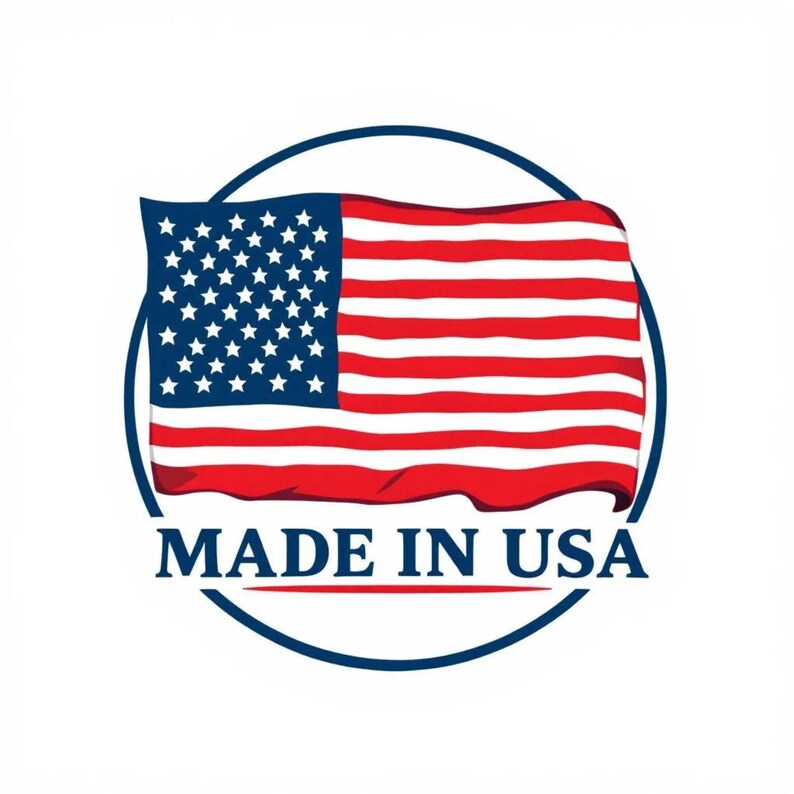 May include: A circular emblem featuring the American flag with red and white stripes and a blue field of white stars. The text "MADE IN USA" is displayed below the flag in a navy blue font.