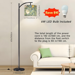 May include: A black floor lamp with a floral patterned lampshade. The lamp is 63 inches (160 cm) tall, with a 10-inch (25 cm) base and a lampshade that is 11 inches (28 cm) wide. The text "6W LED Bulb Included" is visible.