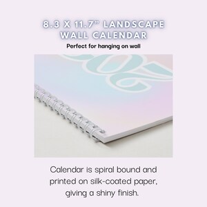 May include: A spiral-bound landscape wall calendar, 8.3 x 11.7 inches, with a pastel-colored design. The calendar is printed on silk-coated paper, giving it a shiny finish. The text on the calendar reads "8.3 X 11.7" LANDSCAPE WALL CALENDAR".