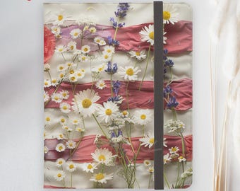 May include: A notebook with a floral design featuring white daisies, purple flowers, and red stripes. A black elastic band secures the notebook. The words "FAST DELIVERY" are in a red circle in the upper left corner.