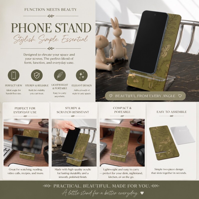 May include: A phone stand with a green and gold floral design, holding a black smartphone. The stand is made of acrylic and features the text "PHONE STAND Stylish Simple Essential". It is designed for everyday use.
