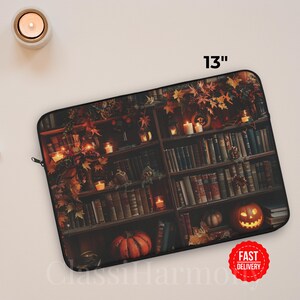Vintage library laptop sleeve with books, glowing candles, pumpkins, and autumn leaves, protective fleece case in 12, 13, and 15 inch sizes