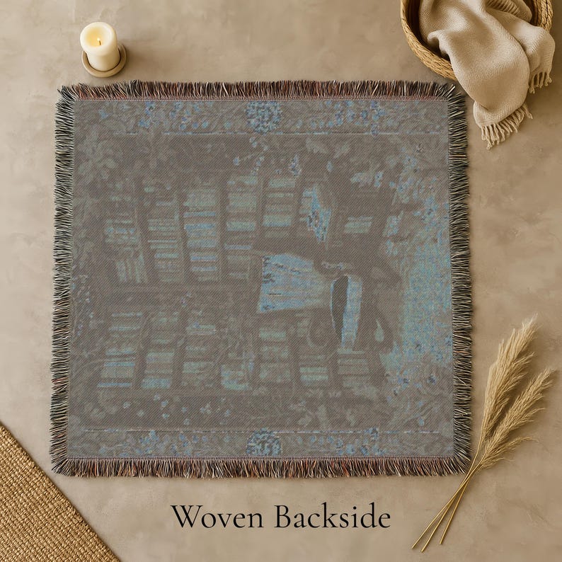 Woven blanket with a warm storybook library scene, draped over a reading chair.
