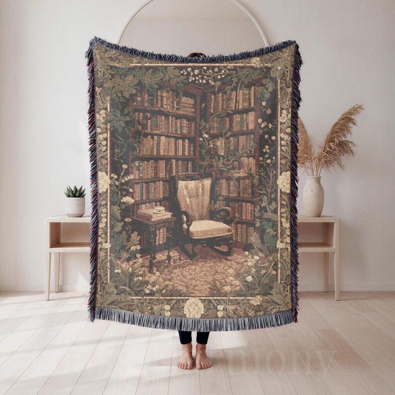 Woven blanket with a warm storybook library scene, draped over a reading chair.