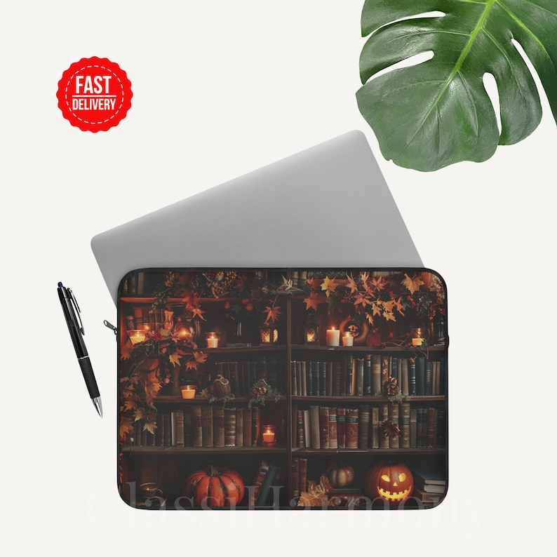 Vintage library laptop sleeve with books, glowing candles, pumpkins, and autumn leaves, protective fleece case in 12, 13, and 15 inch sizes