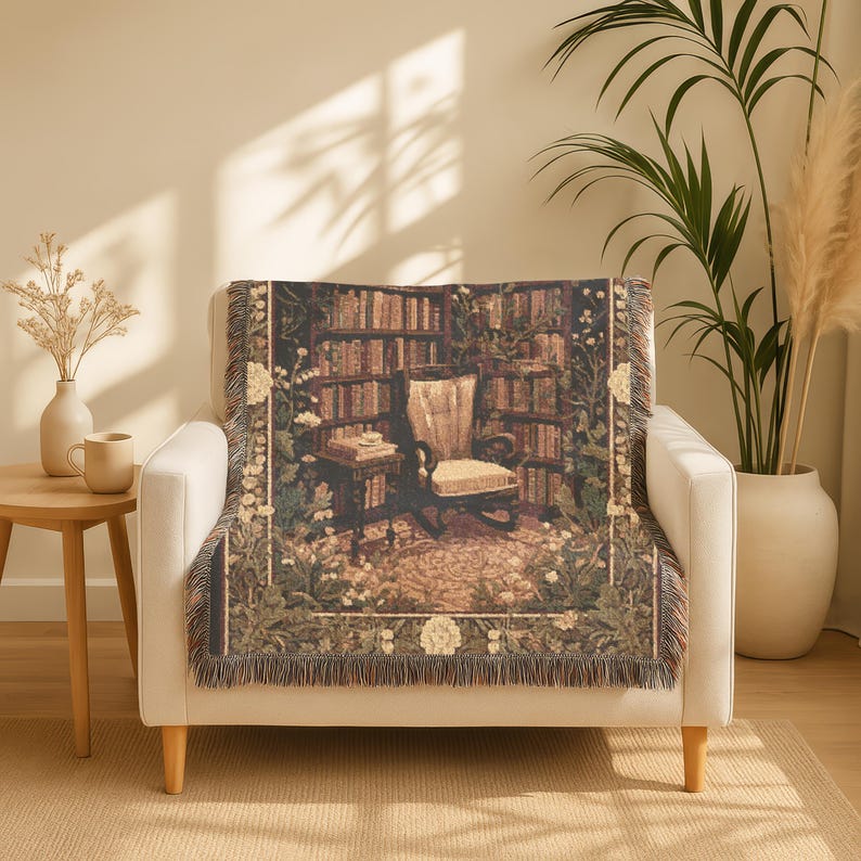 Woven blanket with a warm storybook library scene, draped over a reading chair.