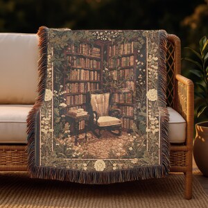 Woven blanket with a warm storybook library scene, draped over a reading chair.