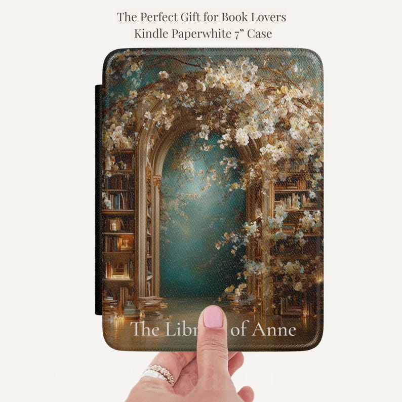 Personalized Kindle Paperwhite case featuring a vintage floral library arch design with teal background and the name Anne in soft white serif lettering.