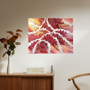May include: Abstract painting with white, red, and orange colors. The painting features a swirling pattern of white lines on a red and orange background.