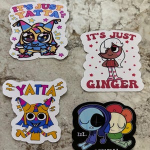 May include: Four colorful stickers with cartoon characters. Two stickers say "It's Just Yatta" with a creature design. Another says "It's Just Ginger" with a girl design. The last sticker says "Official Napping Shirt" with two sleeping characters.