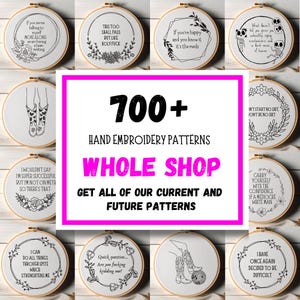 May include: A selection of hand embroidery patterns in wooden hoops. The image showcases diverse designs with text and illustrations, including floral motifs and humorous quotes. The central text reads "700+ Hand Embroidery Patterns Whole Shop."