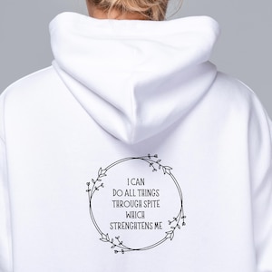 May include: White hoodie with a black floral wreath design and the text "I can do all things through spite which strengthens me".