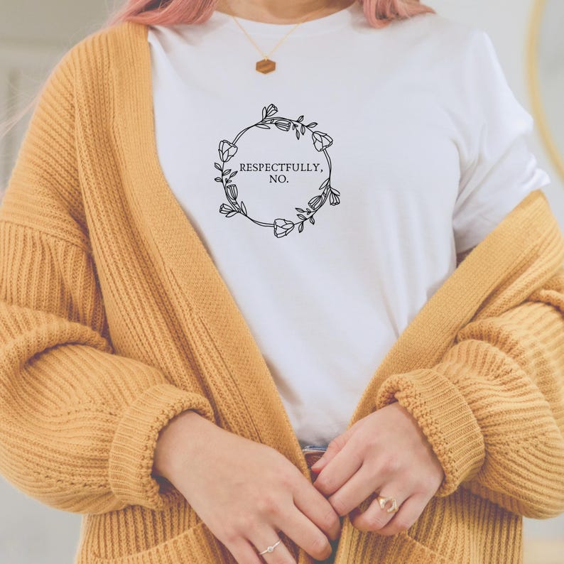 May include: White t-shirt with a floral wreath design and the text "Respectfully, No."