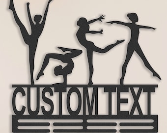 May include: Black metal wall-mounted medal display with four gymnast silhouettes and the text "CUSTOM TEXT". The display has three horizontal bars for hanging medals.