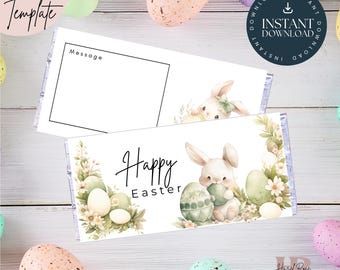 May include: Printable Easter chocolate bar wrapper featuring a watercolor illustration of a bunny holding an Easter egg, surrounded by green leaves and flowers. The text "Happy Easter" is printed on the wrapper.