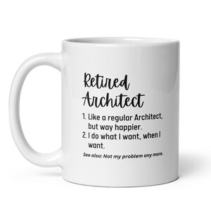 May include: White ceramic mug with the text "Retired Architect" in a black script font. Below the title are three lines of text. The mug has a white handle and is designed for hot beverages.