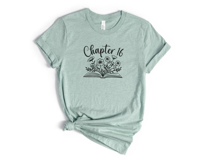 May include: A light green t-shirt with a black graphic of a book with flowers growing out of it and the text "Chapter 16".