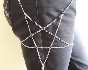 May include: A silver chain body harness with a pentagram design. The chain is attached to a belt loop and has a small pendant at the bottom.