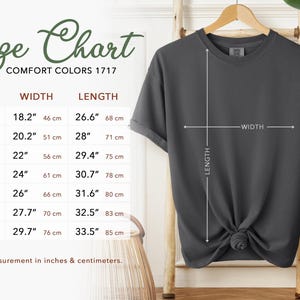 May include: Size chart for t-shirts in sizes S through 4XL. The chart shows width and length measurements in inches and centimeters.  Comfort Colors 1717.