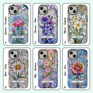 May include: Six phone cases with stained glass designs featuring different flowers and the month they bloom. Each case has a name and the month and flower name printed on it. The cases are for iPhone 13 Pro.