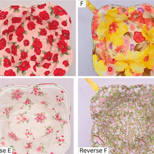 May include: Four floral bowl cozies with matching handles. The cozies feature various floral patterns, including red poppies on a pink background, yellow and orange flowers, pink roses, and a light pink floral design.