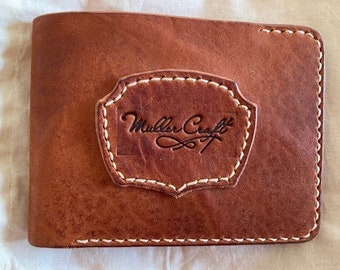 Handmade wallet made from cowhide. 100% handmade. Leather wallet