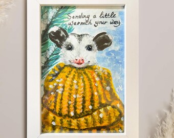 Lámina artística de zarigüeya: «Un poco de calor en tu camino» en marco blanco