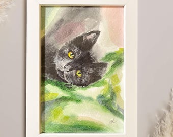 Acuarela pintada a mano: Gato negro tumbado sobre una manta. Obra enmarcada.
