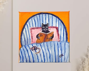Pintura al óleo original: Gato negro leyendo un libro sobre perros en la cama