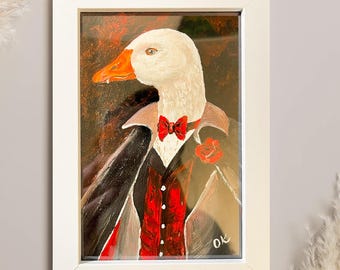 Lámina artística de un ganso divertido: Ganso vampiro con colmillos en marco blanco