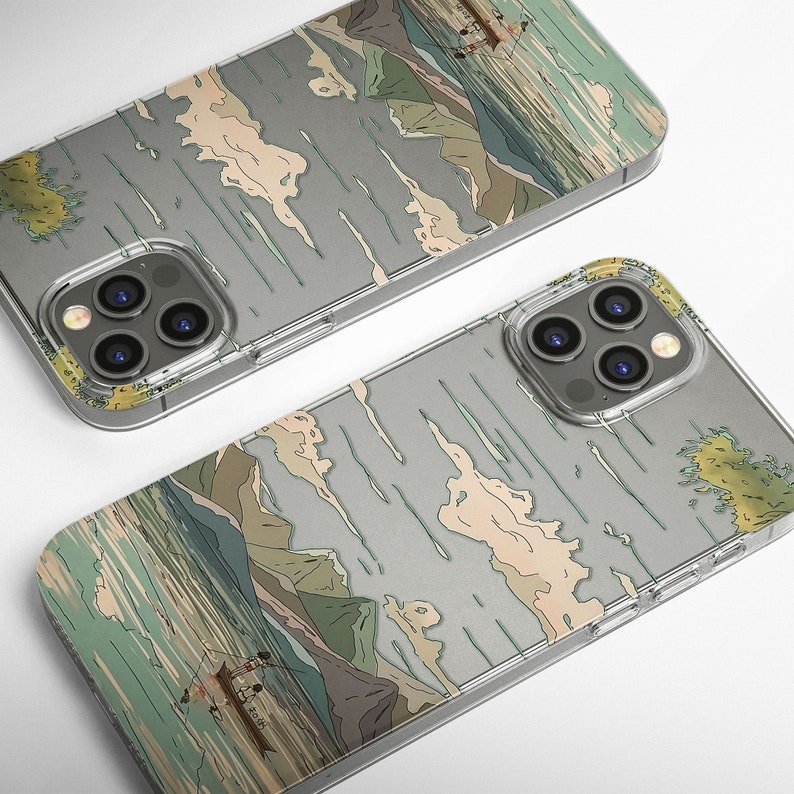 May include: Two iPhone 14 Pro Max phone cases with a Japanese-inspired design. The cases are clear and show a gray and white landscape with mountains and water. The cases have a raised camera bump to protect the phone's camera.