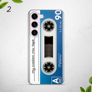 May include: A white and blue phone case with a cassette tape design. The case has the text "my custom mix tape" and "90 2 x 45 min" on it. The case also has the text "Compact Cassette" and "Side A" on it.