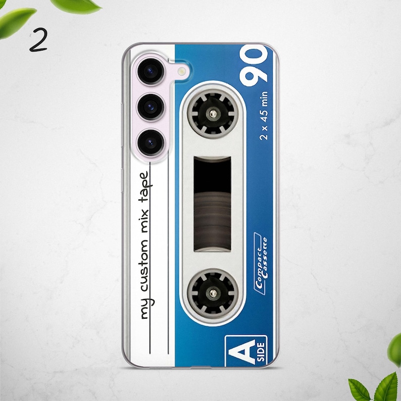May include: A white and blue phone case with a cassette tape design. The case has the text "my custom mix tape" and "90 2 x 45 min" on it. The case also has the text "Compact Cassette" and "Side A" on it.